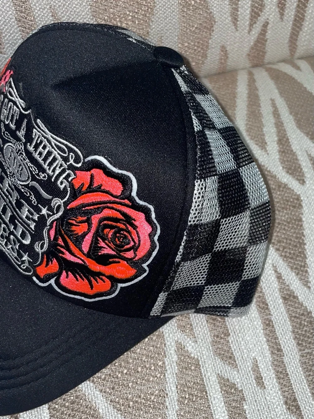 Black Graphic Trucker Hat with Red Rose & Skeleton Hand